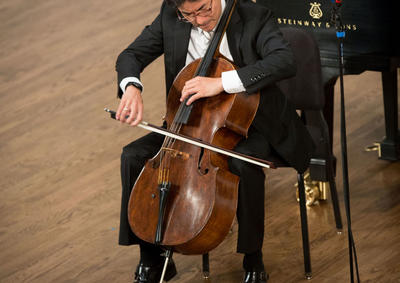Ole Akahoshi playing cello at the 2014 YSM Convocation.