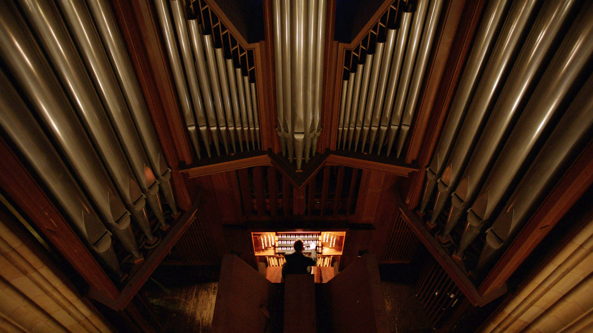 A student playing the organ