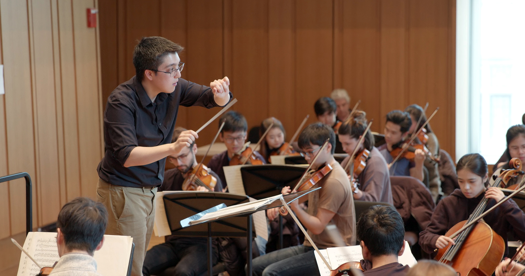 Student conducting orchestra