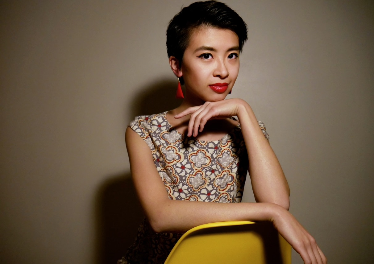 Woman rests head on hand