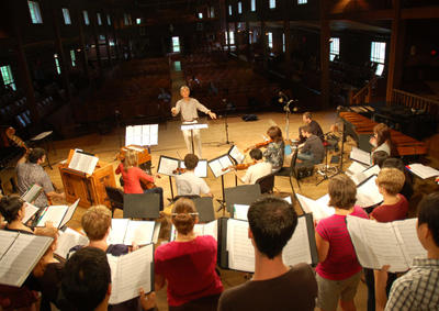 A choir rehearsing in the Music Shed.