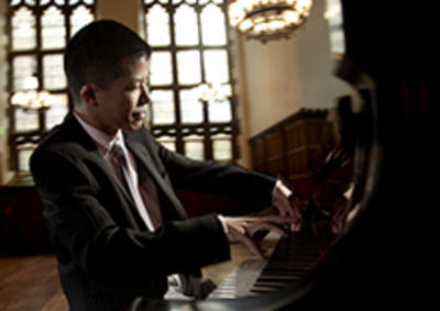 Wei-Yi Yang playing the piano.