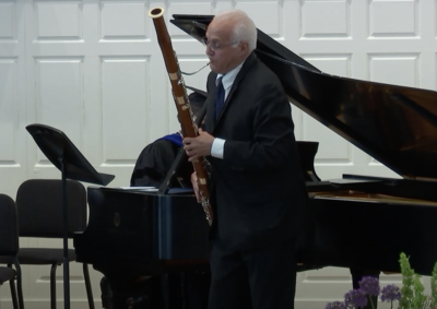 Faculty bassoonist Frank Morelli performs during the 2022 YSM commencement ceremony
